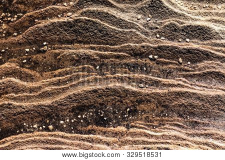 Sandstone Rockface Layers With Pebble Stones Scattered Ideal As Natural Geologic Background