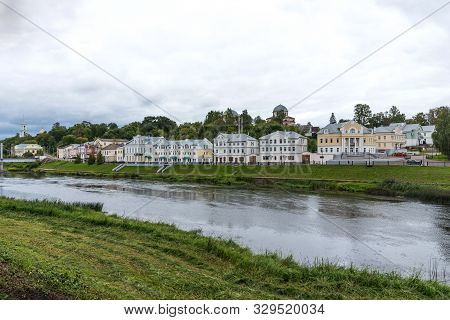 Torzhok, Russia - August 4, 2019: Panoramic Summer View Of The Embankment Of The Tvertsa River With 