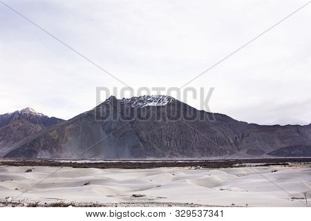 View Landscape With Hunder Or Hundar Sand Dunes Village In Nubra Tehsil Valley At Leh Ladakh In Jamm