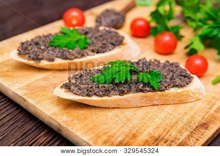 Fresh Tasty Bruschetta With Truffle Sauce, Parsley And Tomates