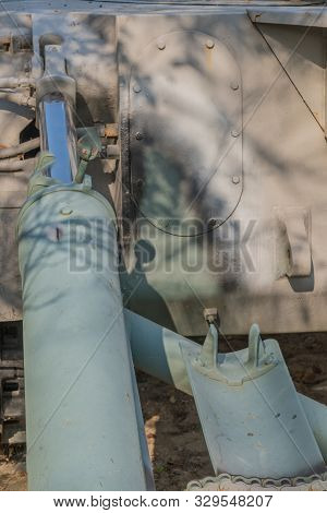 Closeup Of Hydraulic Actuator Of Recoil Spade On Armored Vehicle On Display In Public Park.