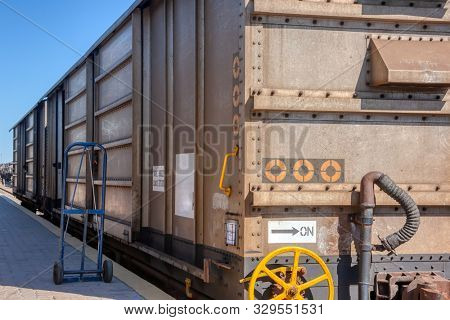 Train wagon for goods, parked in the railway station