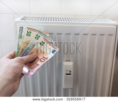 Energy Efficiency Concept With Radiator And Euro Currency - The Cost Of Thermal Energy Is More Expen