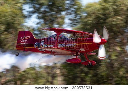Tyabb, Australia - March 9, 2014: 13 Time Australian National Aerobatic Champion Chris Sperou Flying