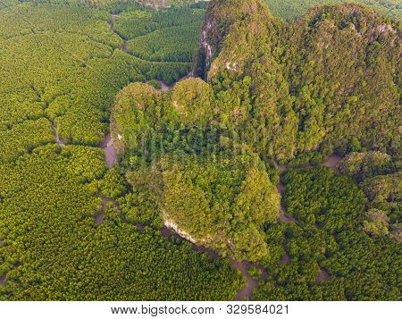 Aerial Top View Of Samet Nangshe And Tropical Green Forest Trees At Sunset With Andaman Sea In Phang