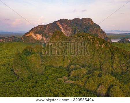 Aerial Top View Of Samet Nangshe And Tropical Green Forest Trees At Sunset With Andaman Sea In Phang