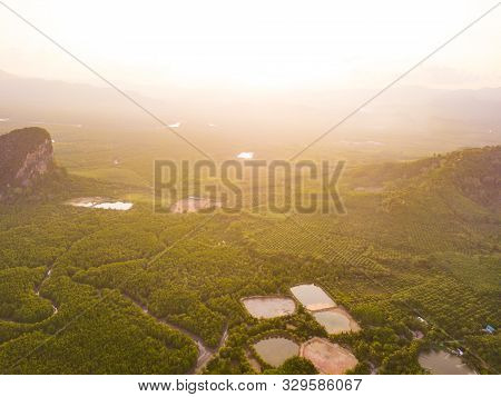 Aerial Top View Of Samet Nangshe And Tropical Green Forest Trees At Sunset With Andaman Sea In Phang