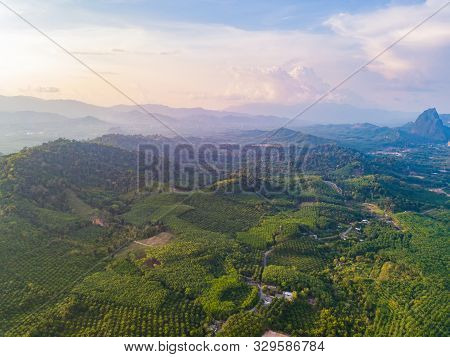 Aerial Top View Of Samet Nangshe And Tropical Green Forest Trees At Sunset With Andaman Sea In Phang