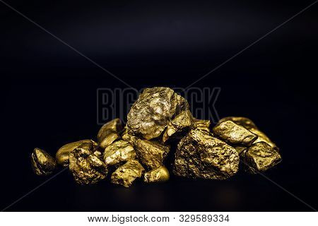 Golden Nuggets Isolated On Black Background. Luxury Concept.