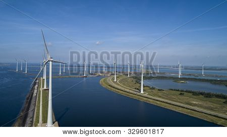 Wind Turbine From Aerial View, Drone View At Windpark Krammersluizen A Windmill Farm In The Lake Gre