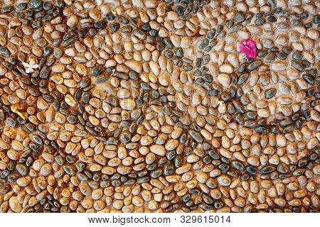 The Sidewalk Is Laid Out Of Pebbles In The Form Of A Beautiful Textured Brushstroke With Lace.