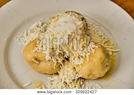 Tasty Homemade Curd (cream Cheese) Dumpling Stuffed With Plums With Hard Curd, Sugar And Melted Butt