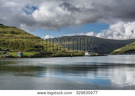 Lake Surrounded By Mountains In The Faroe Islands
