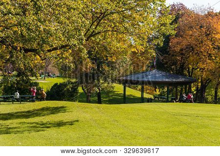 Quebec City, Ca - 5 October 2019 - People Walking In The Battlefields Park In The Autumn Season & Ma