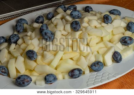 Fruit Platter - Melon, Plum. Close-up Sliced Fruit On A Plate