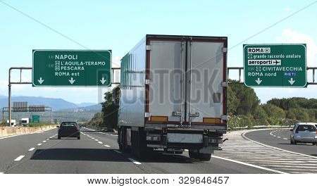 Junction Motorway With Truck And Italian Traffic Signal Near Rome City