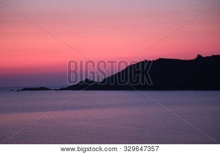Sunset On The Water And The Island