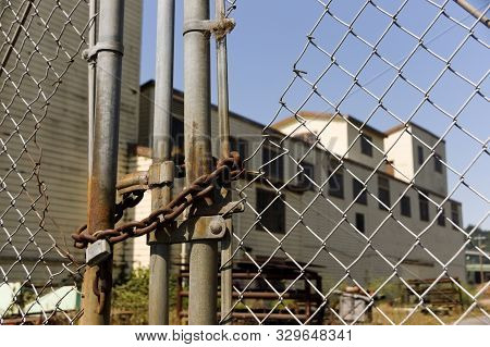 Old Abandoned Locked And Fenced Off Industrial Factory