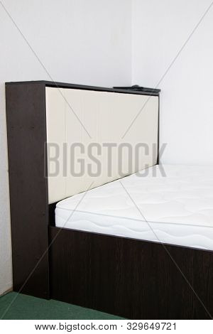 Double Bed With Lifting Mechanism And Mattress. The White Mattress. Large Bright Bed.