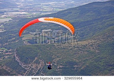 Paraglider Flying From The Chabre, French Alps
