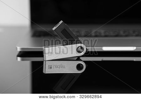 UKRAINE, ROVNO - On 24 October: Ledger hardware wallet for cryptocurrency on a black background