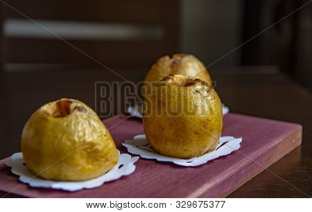 Baked Apples Antonovka On A Blurred Background.