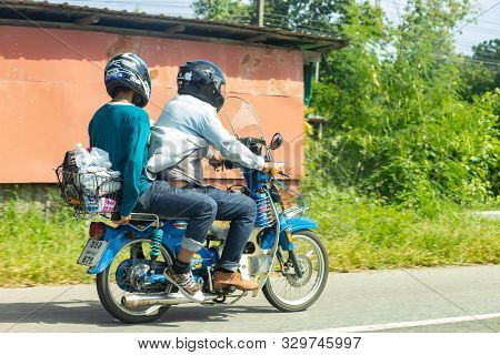 Bangkok, Thailand, Oct 14, 2019 - Man And His Friend Driving An Old Classic Vintage Motorbike With H