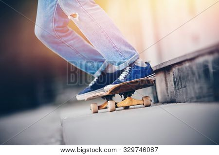 Skateboard Man In Shoes And Jeans Getting Ready To Jump Kickflip Olli From Steps