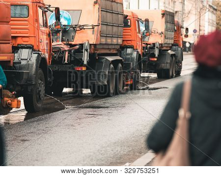 Moscow, Russia - October 19, 2019: Irrigation Sweepers Trucks Stand On The Tram Tracks In Front Of T