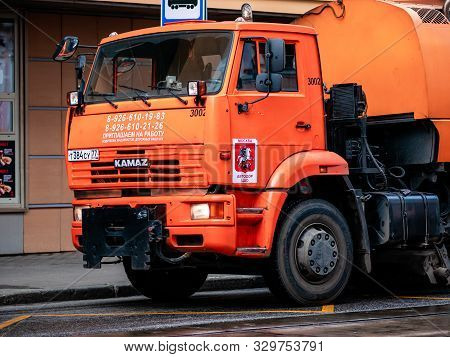 Moscow, Russia - October 19, 2019: Orange Irrigation Sweepers Truck Stand On The Tram Tracks. Moscow