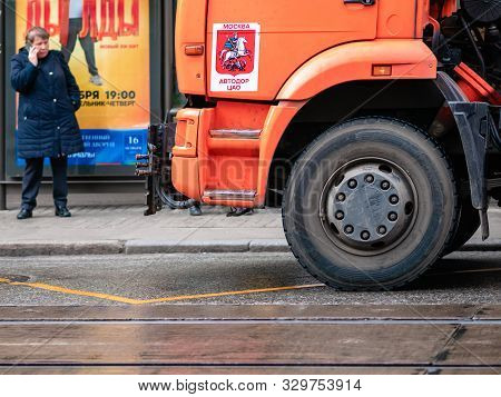 Moscow, Russia - October 19, 2019: Orange Irrigation Sweepers Truck Stand On The Tram Tracks. Moscow