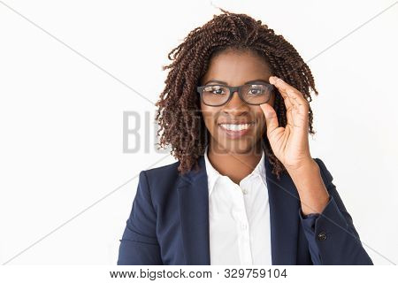Happy Satisfied Customer Trying On Glasses. Young African American Business Woman Touching Eyewear, 