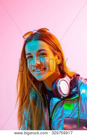 Modern Girl With Laptop, Tablet Computer. Free Creativity. A Young Blogger Makes A Home Office. Colo