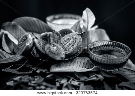 Skin Whitening Remedy/treatment On The Black Shiny Surface Consisting Of Guava Pulp And Honey. Also