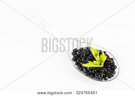 Molecular Cuisine Caviar Elements Shot Closeup Of A Plastic Buffet Table Spoon.