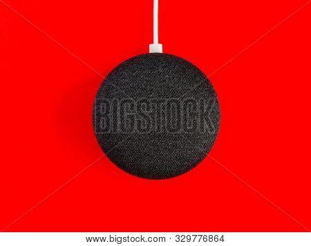 Smart Home Device Speaker On Red Background