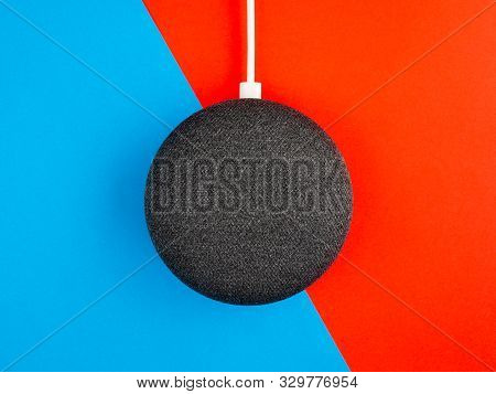 Smart Home Device Speaker On Blue And Red Background