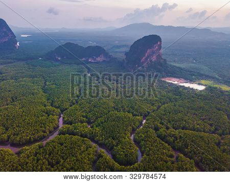 Aerial Top View Of Samet Nangshe, Mountain Valley Hills, And Tropical Green Forest Trees At Sunset W