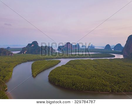 Aerial Top View Of Samet Nangshe, Mountain Valley Hills, And Tropical Green Forest Trees At Sunset W