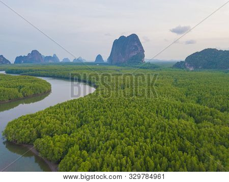 Aerial Top View Of Samet Nangshe, Mountain Valley Hills, And Tropical Green Forest Trees At Sunset W