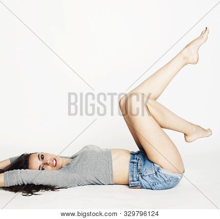 Young Pretty Brunette Woman Head Over Heels On White Isolated