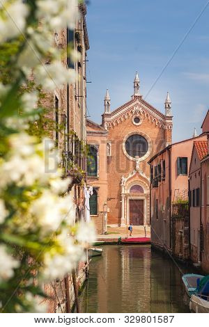 Venice, Italy - June 15, 2017: Canal In Venice And Church Of Madonna Dellorto In The Distance. Canna