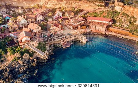 Village Popeye Bay Panorama Malta Sunset, Il-mellieha. Aerial Top View