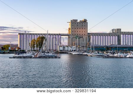 Quebec City, Canada - 4 October 2019: Quebec Harbour At Sunset, With Grain Silos In The Background.