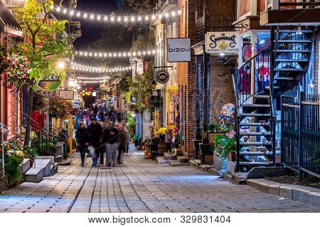 Quebec City, Canada - 4 October 2019: Tourists Visiting Petit Champlain Street In The Old Quebec Cit