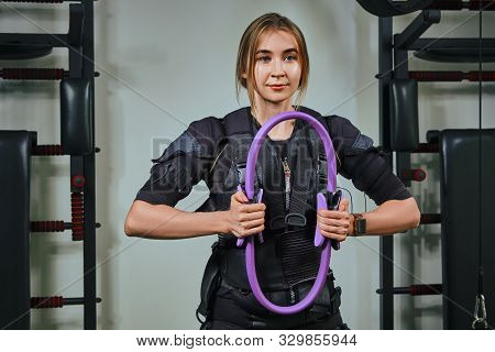 Beautiful Blonde Woman Wearing In Sensors And Belts, Fastens With Velcro Is Practicing Ems Fitness I