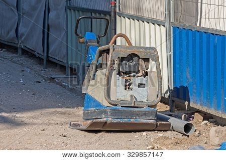 Vibratory Plate Compactor Machine At Street Construction Site