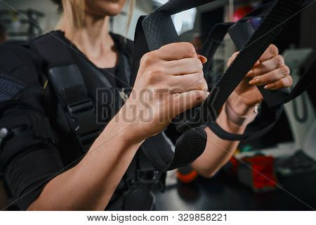 Beautiful Blonde Woman Wearing In Sensors And Belts, Fastens With Velcro Is Practicing Ems Fitness I