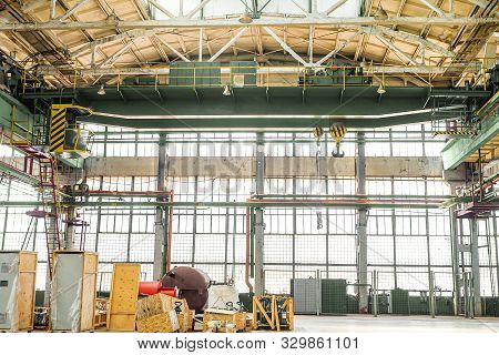 Overhead Crane In Engineering Plant Shop. Industrial Metalwork Production Hall And Warehousing Works