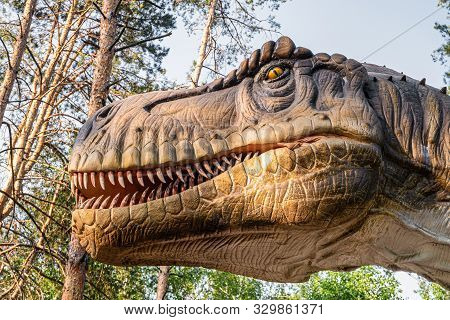 Belgorod, Russia - May 31, 2019: Tyrannosaurus Rex Statue In The Forest Of Belgorod Dinopark. Carniv